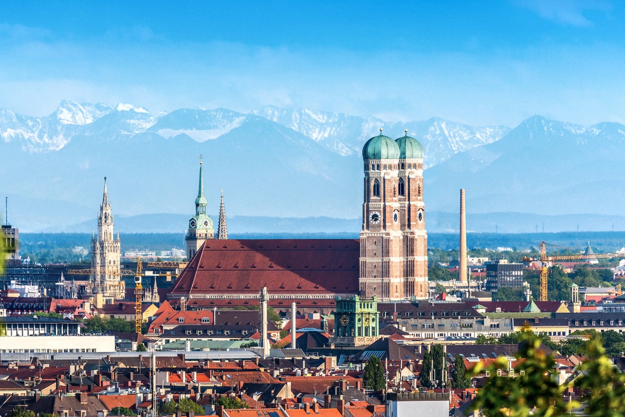 Munich skyline with the Frauenkirche and the Alps